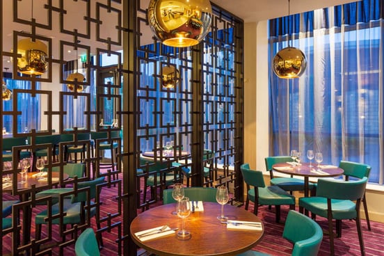 A modern restaurant at Hilton Garden Inn Heathrow where guests can relax and connect with one another