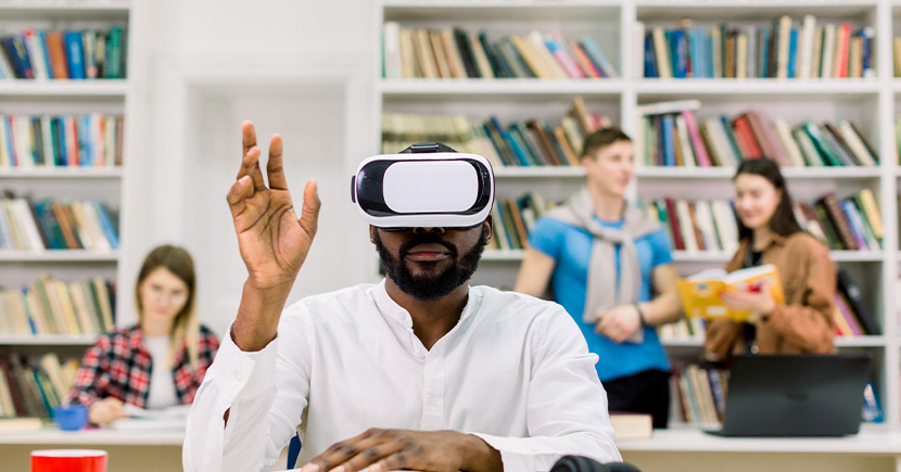 college-student-reading-in-library-wearing-vr-simulator