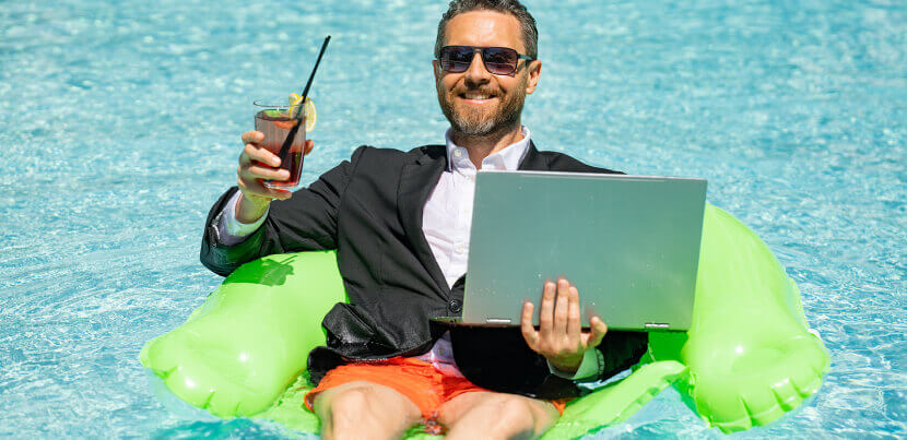 corporate-employee-in-pool-with-laptop