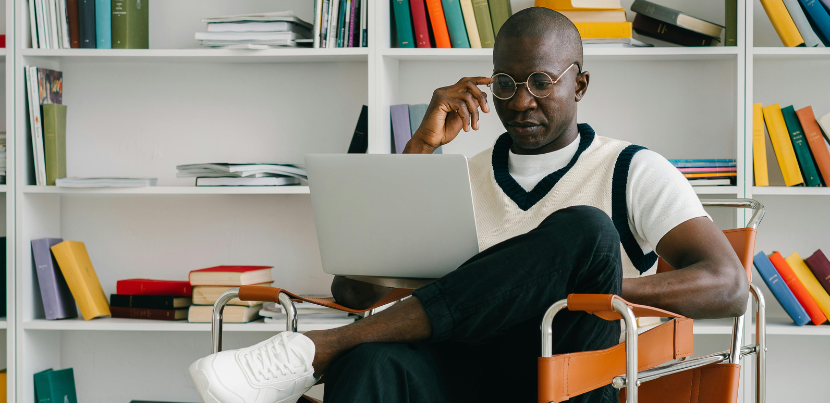 black-man-on-laptop-in-library