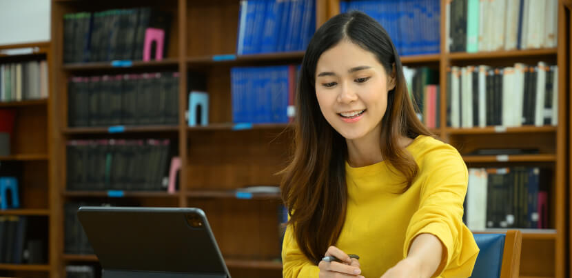female-student-on-desktop-library