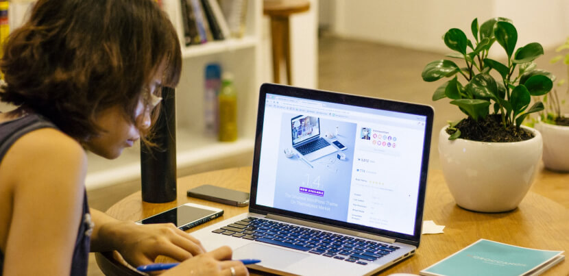 female-student-using-tech-devices-for-research