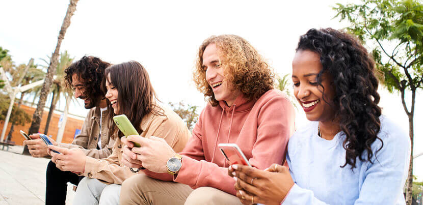 friends-on-smartphones-looking-at-social-media