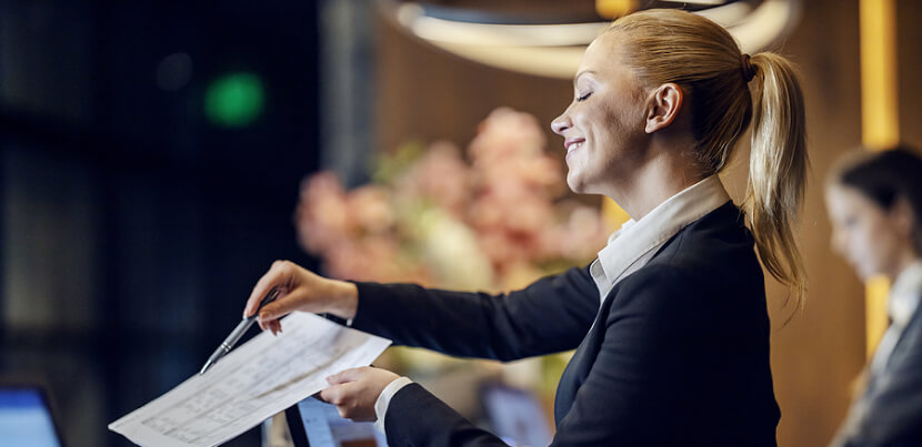 hotel-concierge-helping-guest-with-check-in