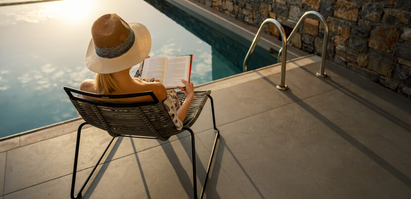 hotel-guest-reading-by-pool