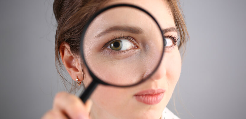 inquisitive-woman-with-magnifying-glass