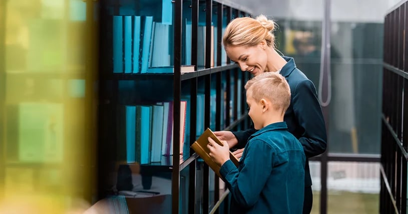 librarian helping a young student