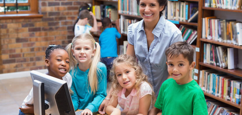 librarian-with-students-at-computer