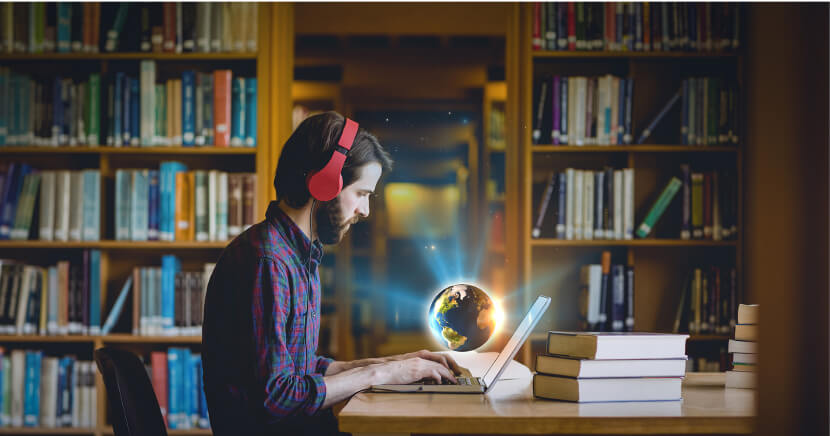 man-using-computer-in-library