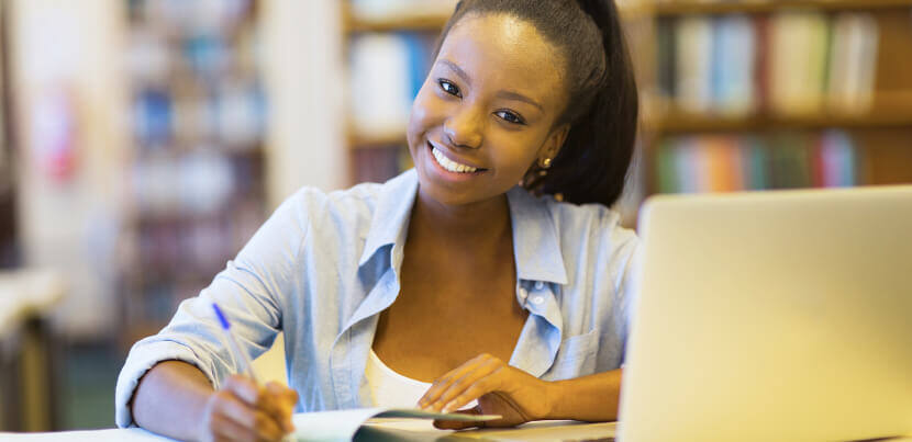 smiling-student-in-library