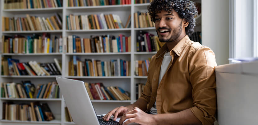 student-in-library-on-desktop