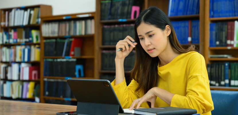 university-student-studying-in-library