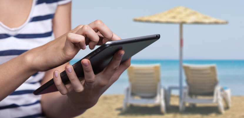 using-tablet-at-the-beach