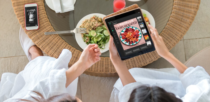 women-at-breakfast-table-reading-on-a-tablet 