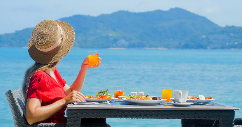 young-woman-in-luxury-resort-having-breakfast