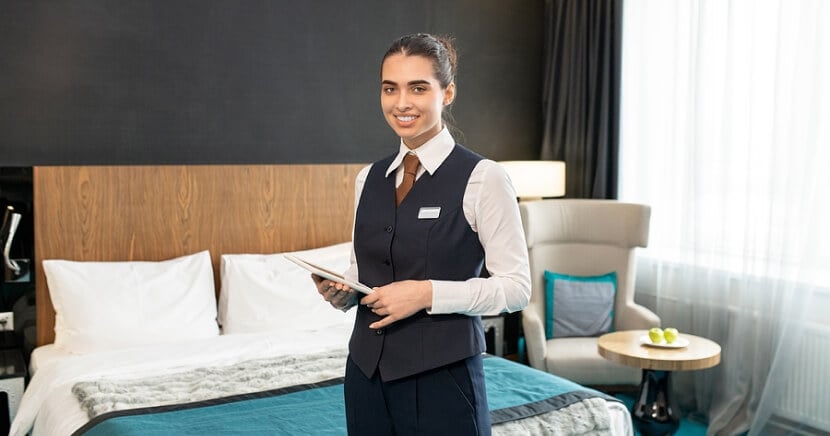 smiling-hotel-worker-in-luxury-suite