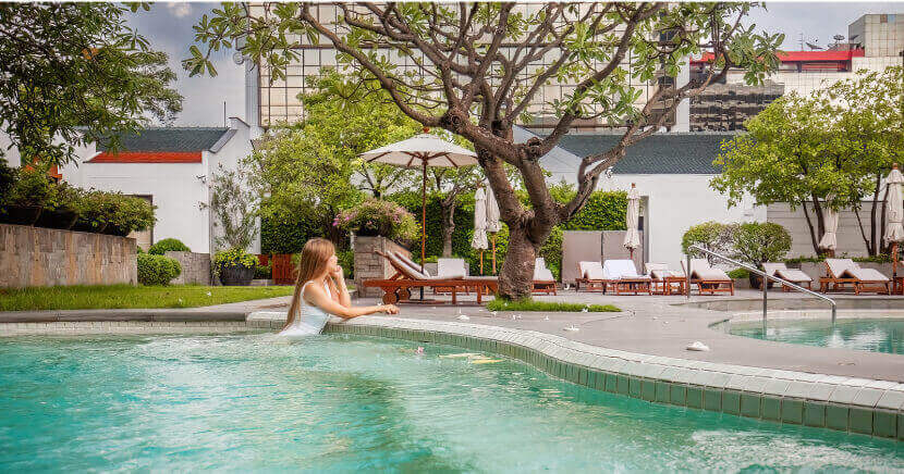 woman-relaxing-in-luxury-hotel-pool